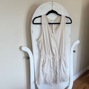 Rae Mode Sleeveless Cream Romper has one spot from a sticker on it